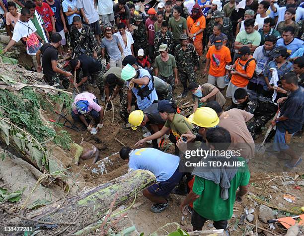 Recuers retrieve the dead body of a 21-year-old woman from a mountain slope after it collapsed at the height of the earthquake in the village of...