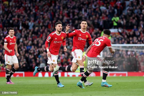 Cristiano Ronaldo of Manchester United celebrates after scoring their team's first goal during the Premier League match between Manchester United and...