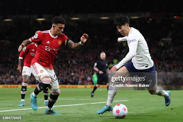 Jadon Sancho of Manchester United looks on as Heung-Min Son of Tottenham Hotspur controls the ball during the Premier League match between Manchester...