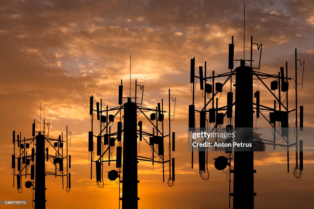 Communication tower on the background of the sunset sky. Communication concept