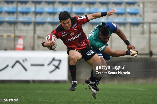 Shohei Toyoshima of Toshiba Brave Lupus is tackled by Maritino Nemani of NEC Green Rockets Tokatsu during the NTT Japan Rugby League One match...
