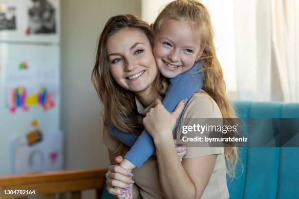 mother and daughter at home - godparent stock pictures, royalty-free photos & images