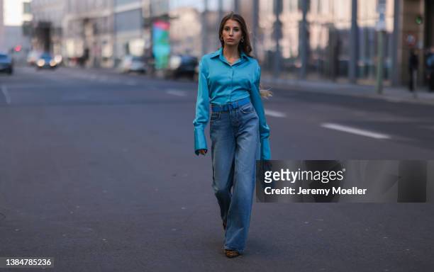 Cathy Hummels wearing The Attico blue silk blouse, Dior blue leather belt and matching Lady Dior blue bag, Girlfriend blue wide denim and Fendi brown...