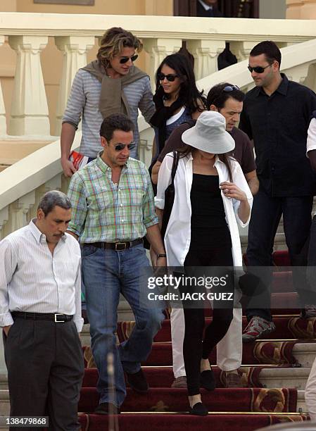 French President Nicolas Sarkozy and his model-turned-singer girlfriend Carla Bruni leave the Winter Palace hotel in Luxor, where they are spending...