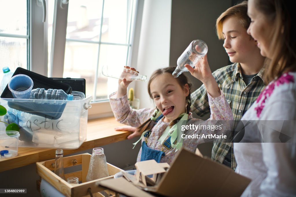 To Sort Out Family Sorting Out Waste For Recycling High-Res Stock Photo - Getty Images