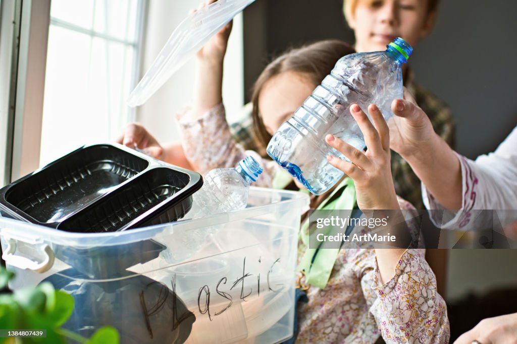 Family  sorting out waste for recycling