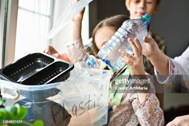 Family Sorting Out Waste For Recycling High-Res Stock Photo