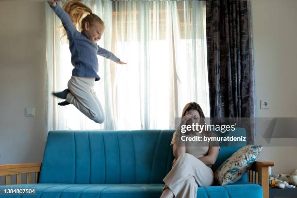 unhappy mommy with daughter - adhd stockfoto's en -beelden