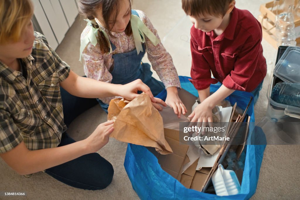 To Sort Out Family Sorting Out Waste For Recycling High-Res Stock Photo - Getty Images
