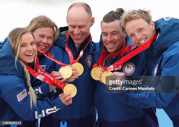 Oksana Masters, Sydney Peterson, Daniel Cnossen, Jake Adicoff and Sam Wood of the United States pose with their gold medals following the Para...
