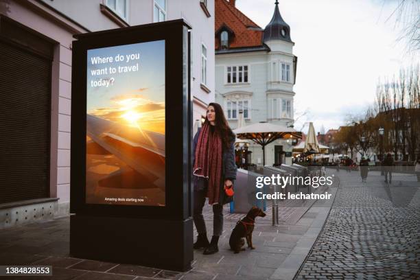 is it time to travel again? - advertising sign imagens e fotografias de stock