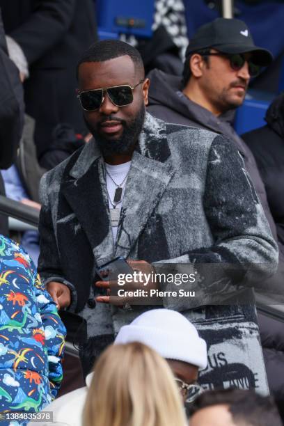 Maître Gims is seen during the Ligue 1 Uber Eats match between Paris Saint-Germain and Girondins de Bordeaux at Parc des Princes on March 13, 2022 in...