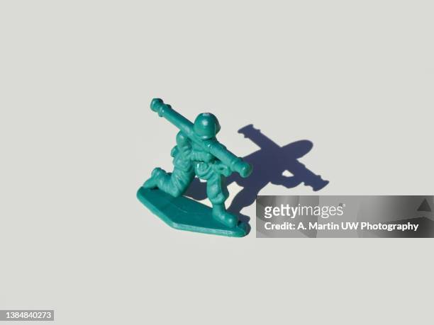 plastic toy soldier with grenade launcher or anti-tank gun isolated on white background. - soldier mapping stock pictures, royalty-free photos & images