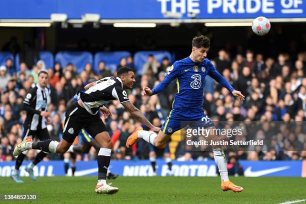 Kai Havertz of Chelsea shoots and misses whilst under pressure from Jamaal Lascelles of Newcastle United during the Premier League match between...