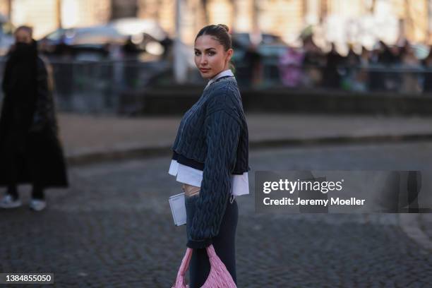 Ann-Kathrin Götze seen wearing a cropped white blouse shirt from Miu Miu, a grey knit midi skirt from Miu Miu, a grey knit cropped pullover from Miu...