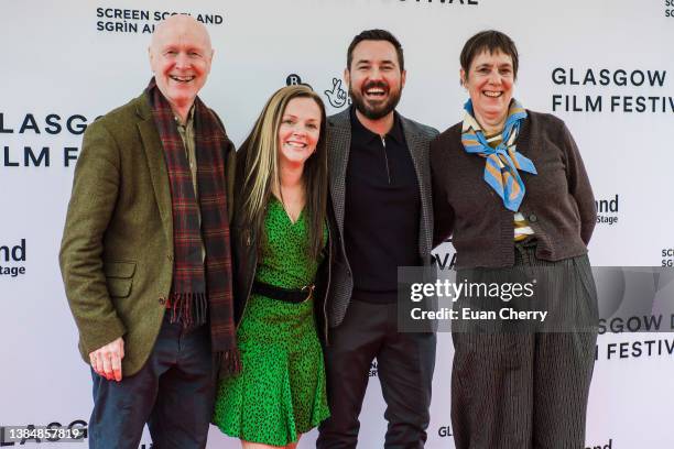 Paul Laverty, Aneemarie Fulton, Martin Compston, Rebecca O'Brien attend the 20th anniversary screening of the film "Sweet 16" on March 13, 2022 in...