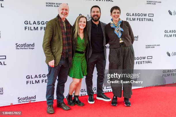 Paul Laverty, Aneemarie Fulton, Martin Compston, Rebecca O'Brien attend the 20th anniversary screening of the film "Sweet 16" on March 13, 2022 in...