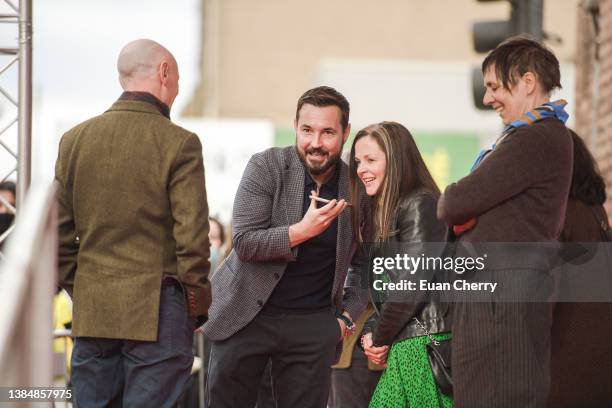 Paul Lavert, Martin Compston, Annemarie Fulton, Rebecca O'Brien attend the 20th anniversary screening of the film "Sweet 16" on March 13, 2022 in...