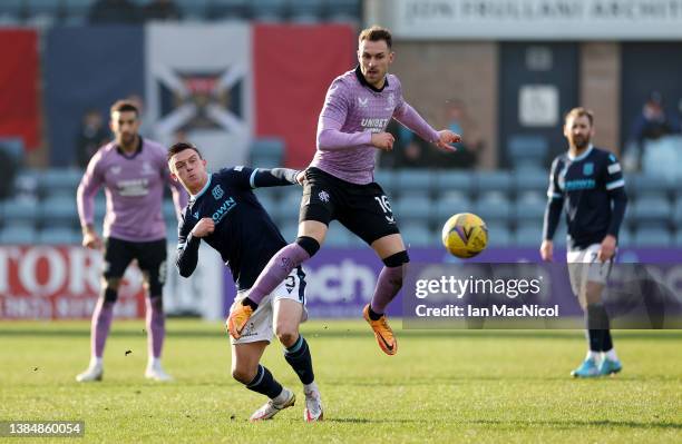 Aaron Ramsey of Rangers and Jordan Marshall of Dundee United battle for possession during the Scottish Cup Sixth Round match between Dundee FC and...