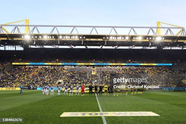 General view inside the stadium as both teams line up prior to the Bundesliga match between Borussia Dortmund and DSC Arminia Bielefeld at Signal...