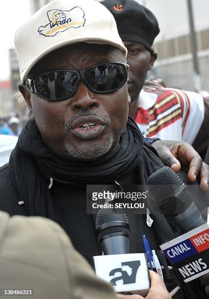 Alioune Tine, coordinator of the M23 opposition movement, speaks to journalists on February 7, 2012 during a march through central Dakar to ratchet...