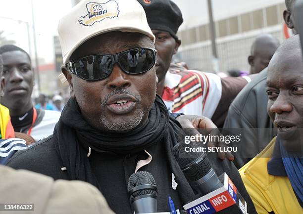 Alioune Tine, coordinator of the M23 opposition movement, speaks to journalists on February 7, 2012 during a march through central Dakar to ratchet...