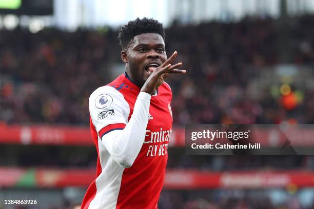Thomas Partey of Arsenal celebrates after scoring their side's first goal during the Premier League match between Arsenal and Leicester City at...