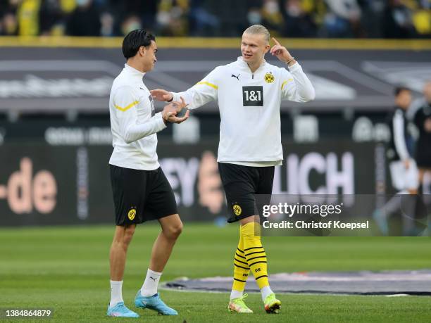 Reinier Jesus Carvalho and Erling Haaland of Borussia Dortmund warm up prior to the Bundesliga match between Borussia Dortmund and DSC Arminia...