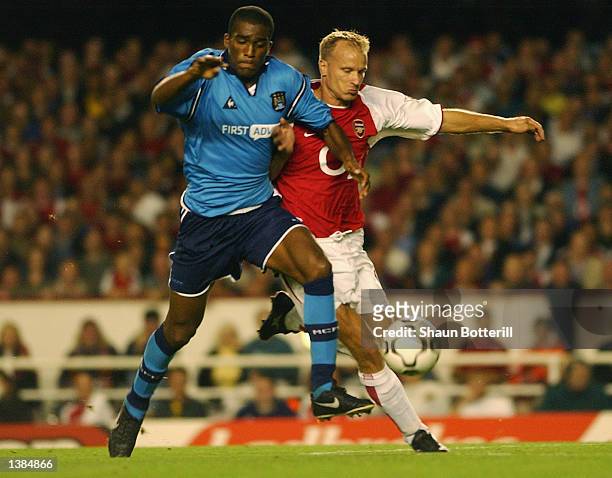 Sylvain Distin of Manchester City battles with Dennis Bergkamp of Arsenal during the FA Barclaycard Premiership match between Arsenal and Manchester...