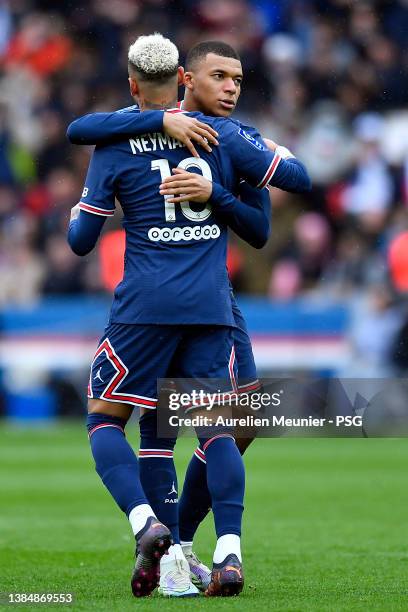 Neymar Jr of Paris Saint-Germain is congratulated by teammate Kylian Mbappe after scoring during the Ligue 1 Uber Eats match between Paris...