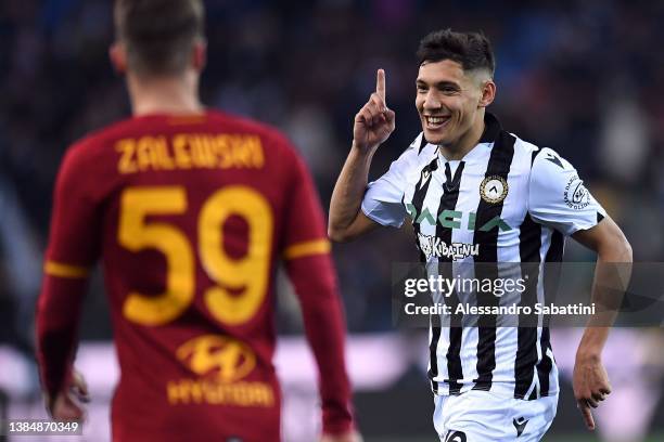 Nahuel Molina of Udinese Calcio celebrates after scoring the opening goal during the Serie A match between Udinese Calcio and AS Roma at Dacia Arena...