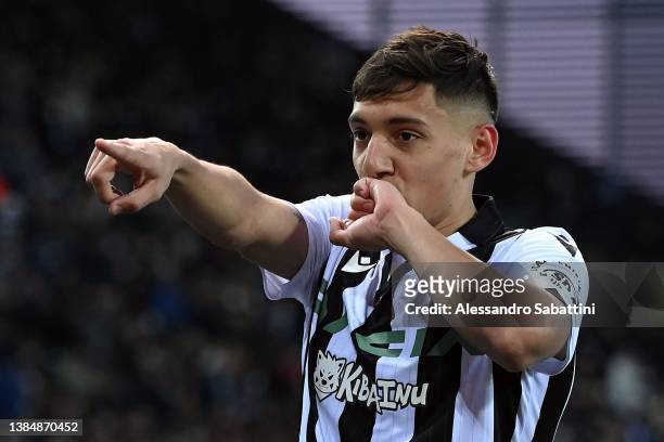 Nahuel Molina of Udinese Calcio celebrates after scoring the opening goal during the Serie A match between Udinese Calcio and AS Roma at Dacia Arena...
