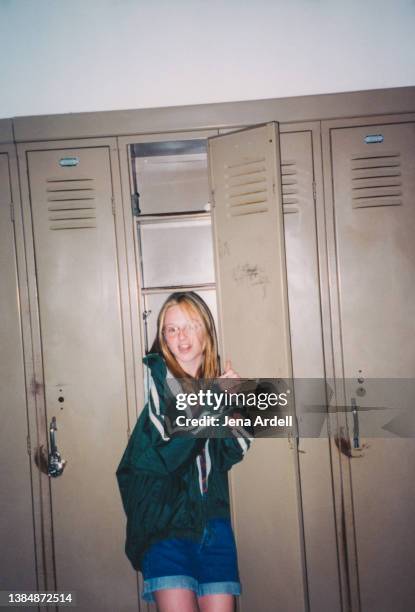 vintage 1990s high school student inside locker, funny candid portrait of awkward nerdy teen girl - fashion archive stock pictures, royalty-free photos & images