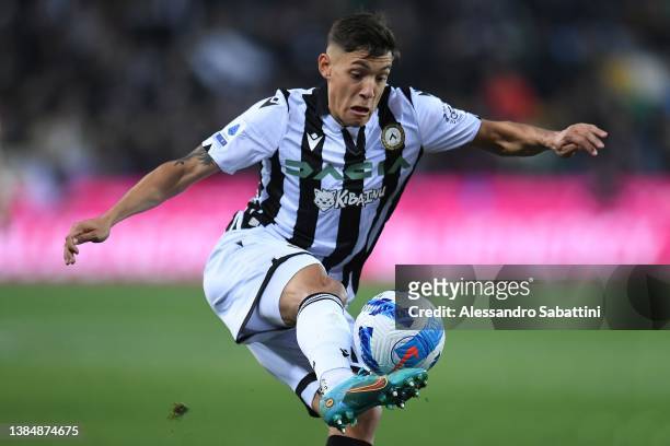 Nahuel Molina of Udinese Calcio in action during the Serie A match between Udinese Calcio and AS Roma at Dacia Arena on March 13, 2022 in Udine,...