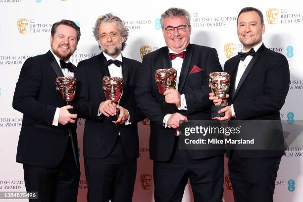 Brian Connor, Gerd Nefzer, Paul Lambert and Tristan Myles posein the winners room with the award for special visual effects award during the EE...