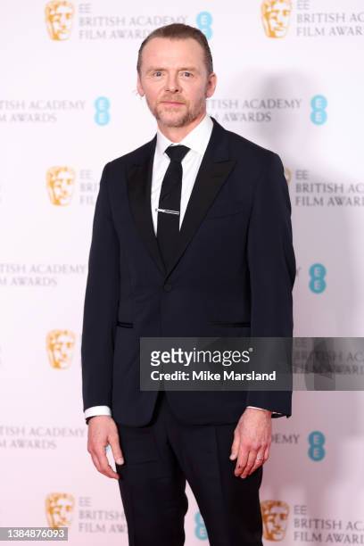 Simon Pegg poses in the winners room after presenting the Special Visual Effects award during the EE British Academy Film Awards 2022 at Royal Albert...
