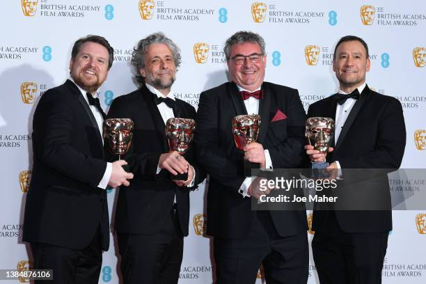 Brian Connor, Gerd Nefzer, Paul Lambert and Tristan Myles pose in the winners room with the award for special visual effects during the EE British...