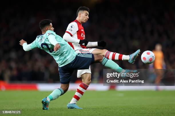 Gabriel Martinelli of Arsenal is challenged by James Justin of Leicester City during the Premier League match between Arsenal and Leicester City at...