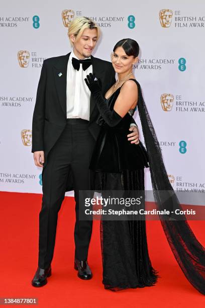 Jake Bongiovi and Millie Bobby Brown attend the EE British Academy Film Awards 2022 at Royal Albert Hall on March 13, 2022 in London, England.