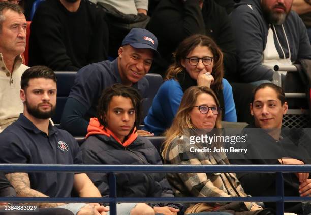 Kylian Mbappe of PSG, his mother Fayza Lamari, above his brother Ethan Mbappe attend - one hour after playing and scoring against Bordeaux - the...