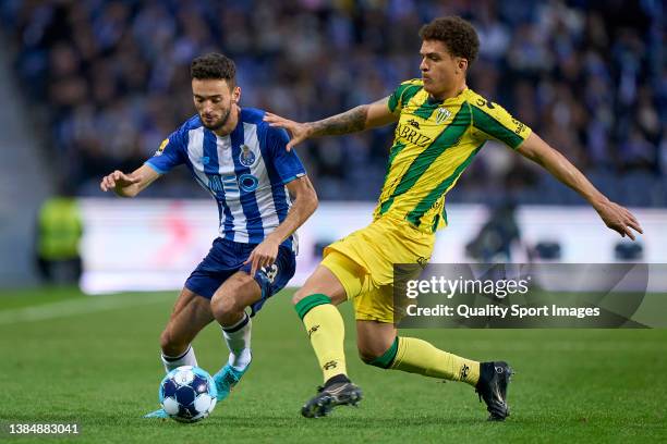 Neto Borges of CD Tondela competes for the ball with Joao Mario of FC Porto during the Liga Portugal Bwin match between FC Porto and CD Tondela at...