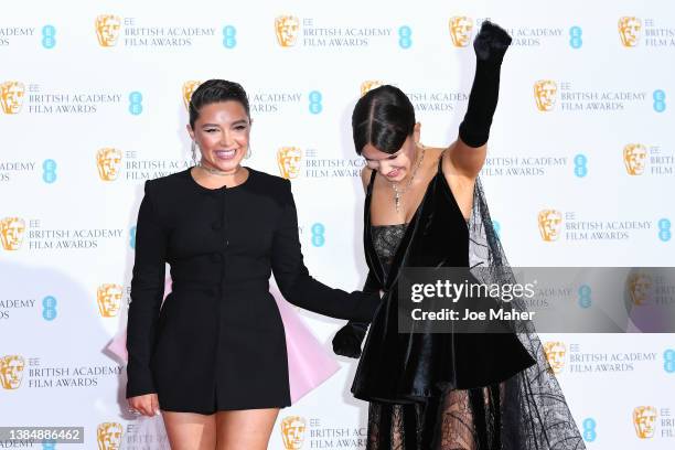 Florence Pugh and Millie Bobby Brown pose in the winners room during the EE British Academy Film Awards 2022 at Royal Albert Hall on March 13, 2022...