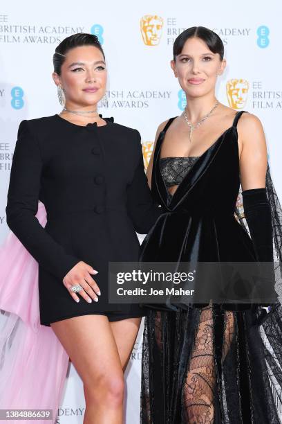 Florence Pugh and Millie Bobby Brown pose in the winners room during the EE British Academy Film Awards 2022 at Royal Albert Hall on March 13, 2022...