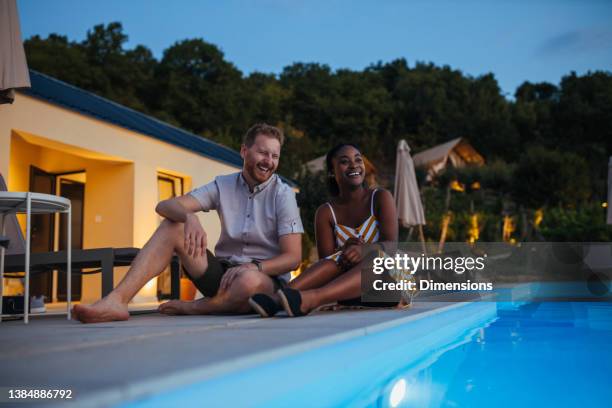 lovely young couple by swimming pool - backyard pool bildbanksfoton och bilder