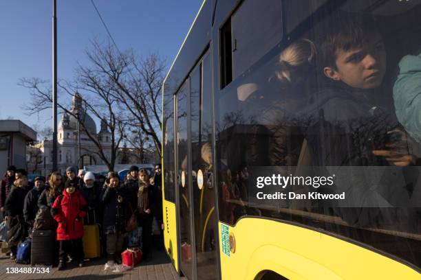 Children cram on a bus heading for the border with Poland on March 13, 2022 in Novoiavorivsk, Ukraine. More than two million people have fled Ukraine...