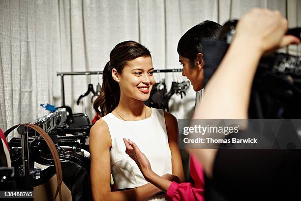 two female models backstage at a fashion show - model backstage stock-fotos und bilder