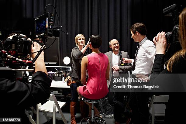 designer being interviewed with model backstage - fashion show stock pictures, royalty-free photos & images