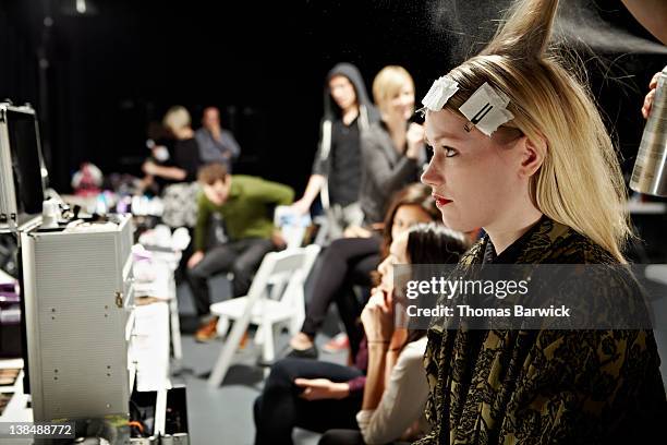 model backstage in hair and make-up - behind the scenes stock pictures, royalty-free photos & images