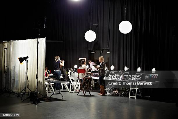 backstage preparation area of fashion show - fashion show stock pictures, royalty-free photos & images