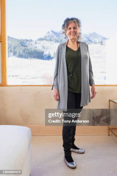 portrait of standing woman at home - black trousers stock pictures, royalty-free photos & images